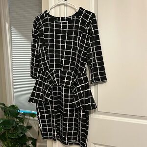 Fun peplum, fitted dress, three quarter sleeves, very comfortable and flattering